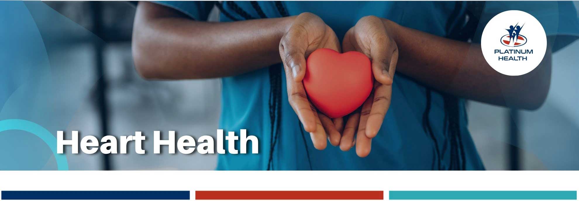 Healthcare professional holding a red heart symbol for heart health – Platinum Health