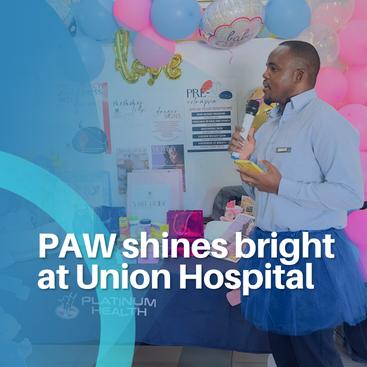 Speaker presenting at PAW event at Union Hospital with decorated setup